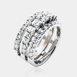 Handmade, triple row princess cut diamond ring with three rows of princess cut and round diamonds in 18ct white gold.