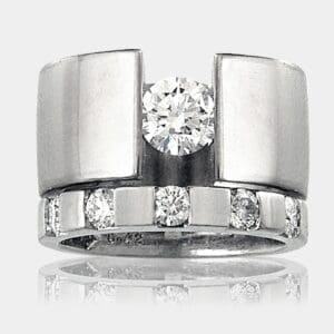 Suspension set 0.62 carat diamond ring in 18ct white gold and matching diamond and white gold wedding band.