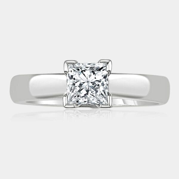 1.00 carat Princess cut solitaire diamond ring with v-claw setting in 18ct white gold.