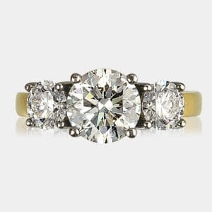 3 stone round brilliant cut diamond ring totaling 2.74 carat, set in 18ct white and yellow gold.