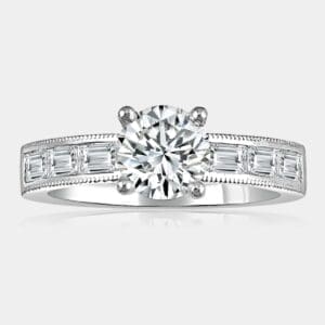 0.83 carat round brilliant cut diamond engagement ring in 18ct white gold with baguette cut shoulder diamonds.