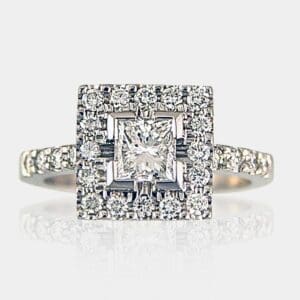 Princess cut diamond ring with round diamond halo surrounding centre stone and round diamonds in the band.