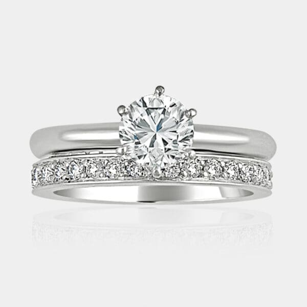 0.74 carat Round brilliant cut engagement ring with matching diamond wedding ring.