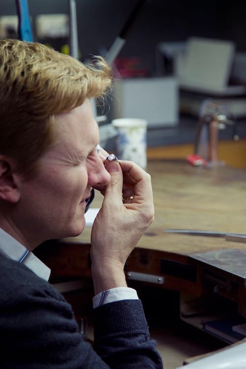 Richard inspecting jewellery diamond stone in the workshop